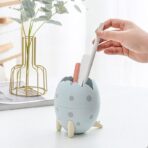 Portalápices con forma de huevo de dinosaurio recipiente de almacenamiento organizador de escritorio para esferos lapiz FK23D-222